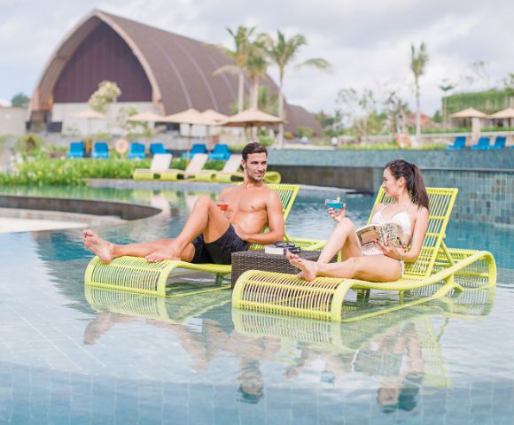 Guests relaxing in the Merusaka Nusa Dua pool