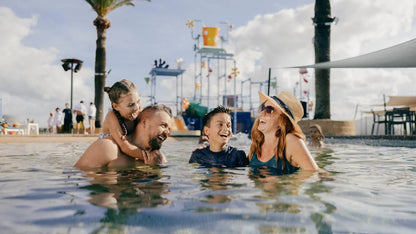 Family enjoying Sea World Resort aqua play pool